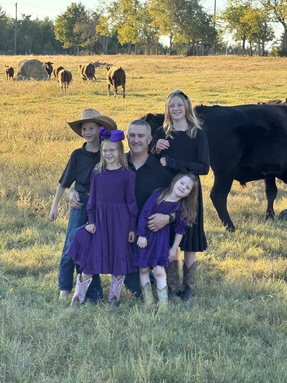 The Rigid Ranch family with the herd at sunset in Van Alstyne, Texas